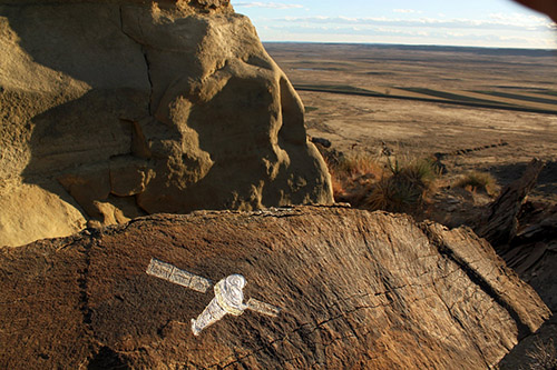 Chandra Observatory over Winter Wheat Fields;  November 2010; Rim rock capstone (collapsed), carving, 21 & 23 carat gold leaf, varnish; 16"x12"; Sumatra Hills, Montana.