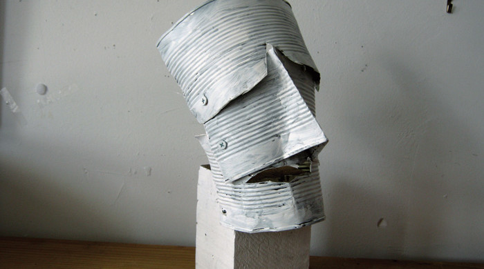 Lawrence Swan, Head On Block, 2012. Tin cans, wood block, acrylic paint, 13" X 7" X 6"