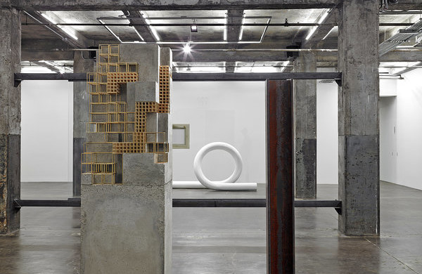 Carol Bove, Peel’s Foe, not a set animal, laminates a tone of sleep (2013). Brass and concrete. Image courtesy of Maccarone.