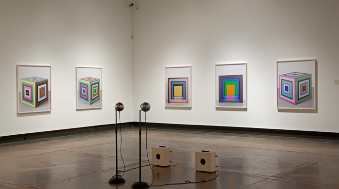 Clockwise starting left: Jessica Eaton, cfaal 314, from the Cubes for Albers and Lewitt series, 2013; cfaal 312, from the Cubes for Albers and Lewitt series, 2013; cfaal 279, from the Cubes for Albers and Lewitt series, 2013; cfaal 276, from the Cubes for Albers and Lewitt series, 2013. All prints are 127 cm x 1016 cm and are courtesy of the artist and Jessica Bradley Gallery. Marla Hlady in collaboration with Eric Chenaux, Soundball (Dancehauling), 2013, sound, 2 custom guitar amps, and 2 soundballs (stainless steel rice ball, microprocessor, sound board, accelerometer, LEDs and cable), dimensions variable. Courtesy the artist and Jessica Bradley Gallery. Image  courtesy of the Kitchener-Waterloo Art Gallery. Photo by Robert McNair.