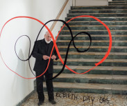 Michaelangelo Pistoletto and his symbol for the Third Paradise. Image courtesy of Galleria Continua.