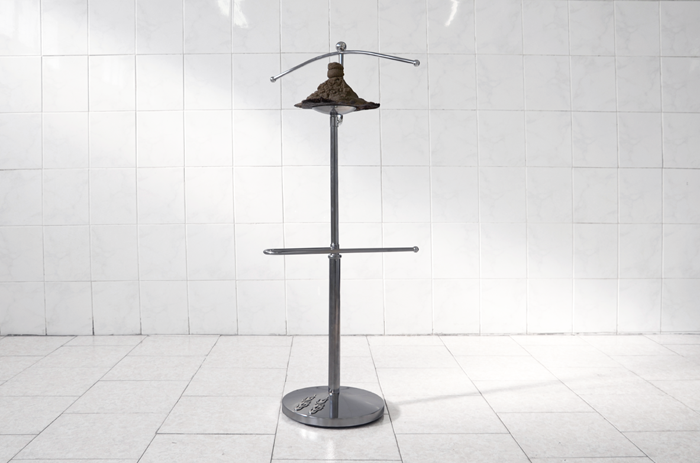MICHELE GABRIELE “Holdythang” Clothe-hanger, sand, soil, chrome stickers 2015