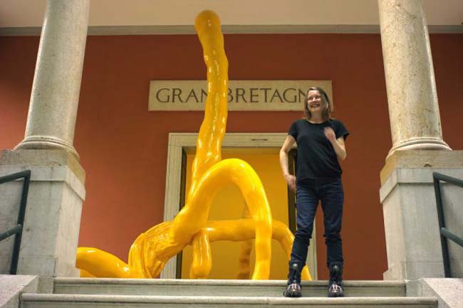 British artist Sarah Lucas poses next to her sculpture 'Gold Cup Maradona' part of her installation 'I Scream Daddio' at the British pavilion at the 2015 Biennale of Arts in Venice, Italy, Wednesday, May 6, 2015. Photo: Domenico Stinellis, AP