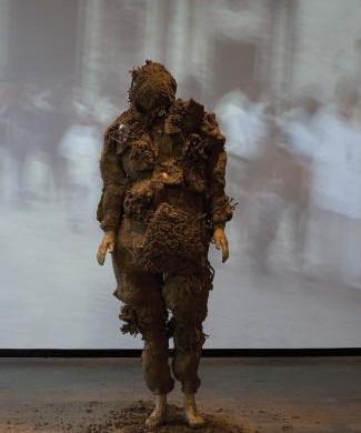 Tania Bruguera’s original performance of  Displacement, 1998-99, Cuban earth, glue, wood, nails and fabric; in Havana.