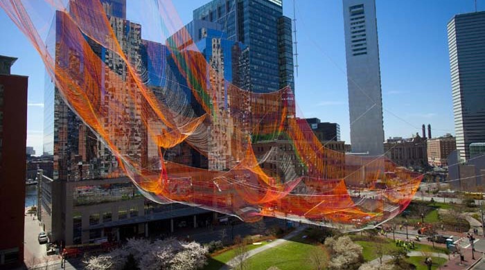 The vast net of rusty orange, magenta, and green hues will float above the Greenway until October. Dina Rudick/Globe Staff