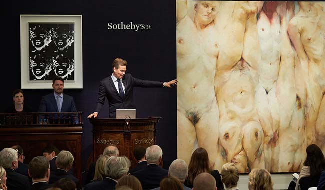 Andy Warhol's “Four Marilyns (Reversal Series)” (1979-86) and Jenny Saville's “Shift” (1966-67) are auctioned off at Sotheby's Contemporary Art Evening Sale, June 28, 2016.
(Courtesy of Sotheby's )